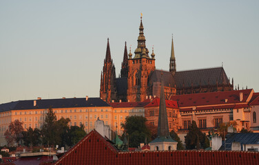 Sunrise over Prague Castle and Saint Vitus Cathedral, amazing warm autumn light early in the morning. Travel to Czech republic.