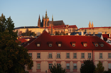 Sunrise over Prague Castle and Saint Vitus Cathedral, amazing warm autumn light early in the...