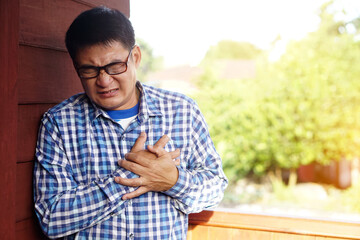 Closeup man  feel hurt his chest. pain suffering from heart attack symptom. Concept : health...