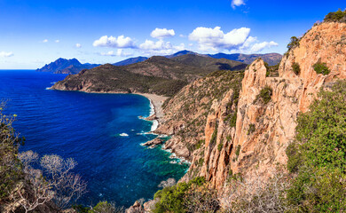 Fototapeta na wymiar Corsica, France. Amazing red rocks of Calanques de Piana. famous route and travel destination in west coast of the island in gulf of Porto