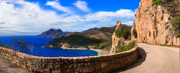 amazing Corsica island nature landscape. Scenic road near Porto Ota with famous red rocks, western...