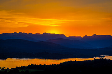 Fototapeta na wymiar View of sunset over Windermere in Lake District, a region and national park in Cumbria in northwest England