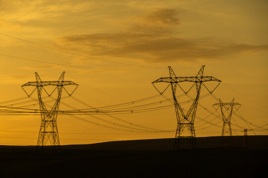 Silhouette Of Power Lines At Sunset Hour