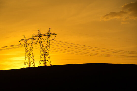 Silhouette Of Power Lines At Sunset Hour