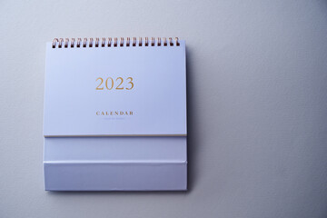 2023 desk calendar on color background