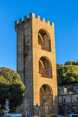 Fototapeta na wymiar Florence, Italy. Gate (tower) of St. Nicholas - part of the ancient fortress wall, 1324
