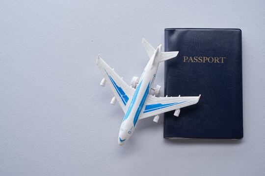 top view of toy air plane and passport