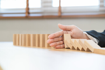 Protection finance, stopping falling block effect collapse domino wooden, Recovery risk business, Management strategy and planning before destroy. Successful intervention.