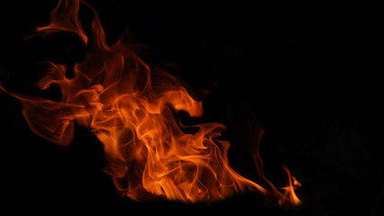 Blurred Stack of thermal energy close-up, red and yellow, heat energy igniting fuel during night/light on black background