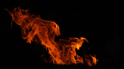 Stack of thermal energy close-up, red and yellow, heat energy igniting fuel during night/light on...