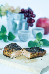 two half cuts salmon with herbs