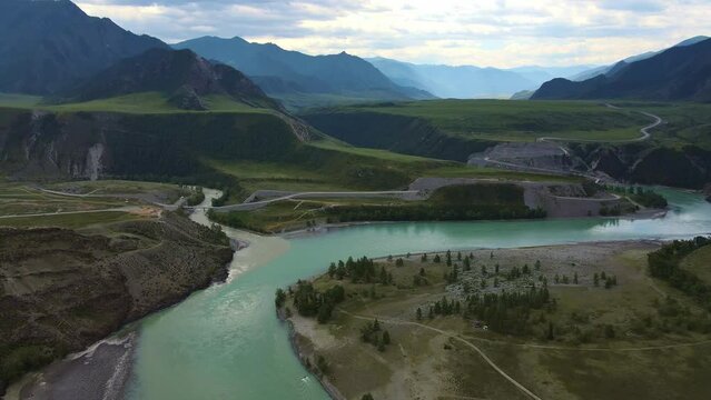 Aerial: Mountain valley. The confluence of the Chuya River and Katun