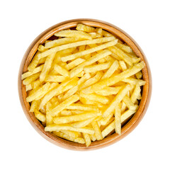 Salted potato sticks in a wooden bowl. Also called shoestring potatoes, a popular snack and variant of crispy potato chips. Extremely thin versions of French fries, deep fried in sunflower oil.