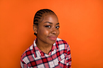 Photo of pretty funny woman dressed plaid shirt smiling listening you isolated shine vibrant orange color background