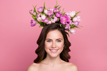 Obraz na płótnie Canvas Photo of charming sweet young woman naked shoulders holding flowers blossom wreath isolated pink color background