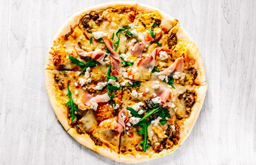 Pizza with Mozzarella cheese, meat, beef, ham, mushroom, shrimp, spices. Italian pizza