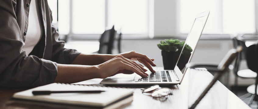 Woman hands typing on computer keyboard closeup banner, businesswoman or student girl using laptop at office, online learning, internet marketing, working from home, office workplace freelance concept
