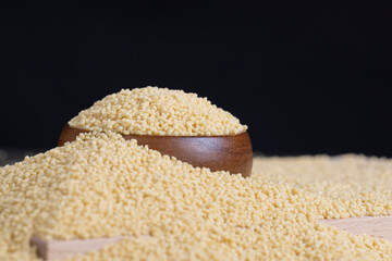 Fresh raw porridge couscous from wheat or millet