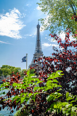 The famous Eiffel Tower in Paris with a dramatic sky