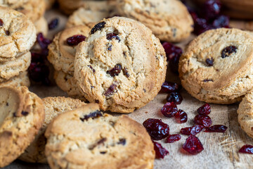 delicious dried cookies made of high-quality flour with dried red cranberries on the table