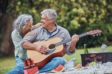 Music, guitar and a senior couple on picnic in park laughing with food, drinks and romance in...