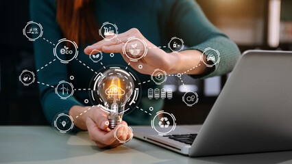 business people working with light bulb and green renewable energy worker interface. Concept of sustainability  business based on renewable