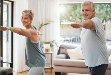 Yoga, fitness and senior couple doing home workout, training and wellness exercise in the living...