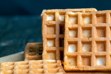 square sweet soft waffles on the table