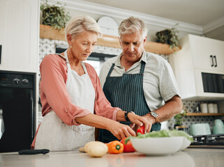 Elderly, couple and kitchen for cooking with vegetables for dinner with nutrition food. Man, woman...