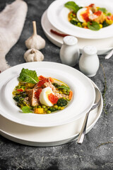 Mediterranean Vegetable Soup with Fish and Pesto. Delicious and healthy food. Minimum calories. Vertical shot. Copy space
