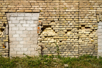 Old abandoned wall with bricked up windows