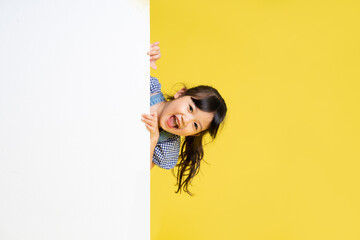 beautiful asian girl portrait, isolated on yellow background