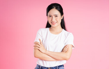 Fototapeta premium beautiful asian girl portrait, isolated on pink background