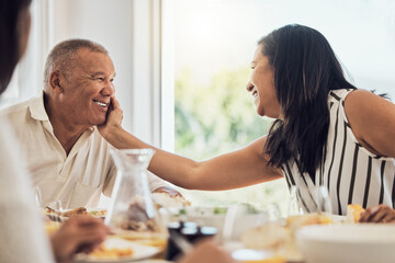 Couple, love and food with a woman and man eating during a family lunch or dinner in their home together. Happy, smile and retirement with a married husband and wife enjoying a meal in a dining room