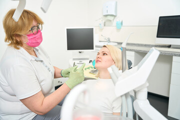 Caucasian woman at the reception at the dentist