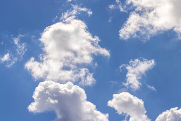 Naklejka na ściany i meble Clouds floating across the sky in the daytime