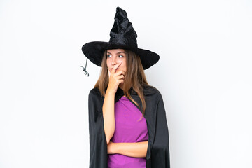 Young caucasian woman costume as witch isolated on white background having doubts and with confuse face expression