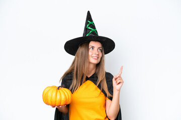 Young caucasian woman costume as witch holding a pumpkin isolated on white background pointing up a great idea