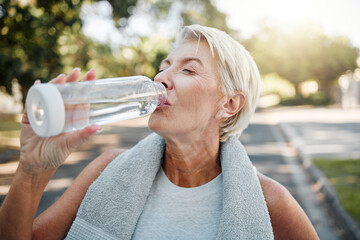 Senior fitness woman drinking water bottle outdoors after training, running workout and exercise in...