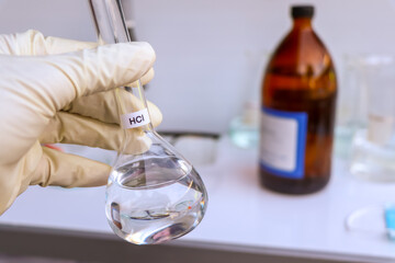 hydrochloric acid in glass, chemical in the laboratory and industry