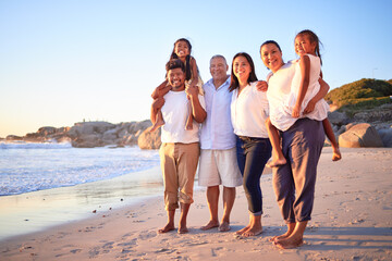Travel, portrait and family at the beach at sunset, happy and relax while walking and bonding at...