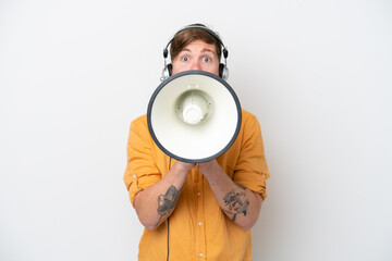 Telemarketer man isolated on white background shouting through a megaphone