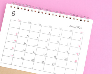close-up of calendar August month of 2023 on a pink background - obrazy, fototapety, plakaty