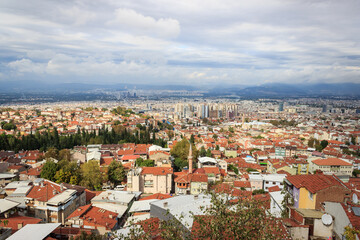 Fototapeta na wymiar Aerial view of Bursa city with cloudy sky. Bursa is touristic destination in Turkey.