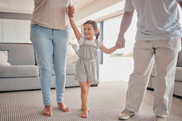 Fototapeta premium Kids, family and love with a girl, mother and father holding hands in the living room of their home. Children, smile and care with a happy female child and parents in a house on a weekend morning