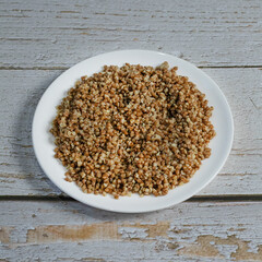 buckwheat in a bowl on a wooden table
