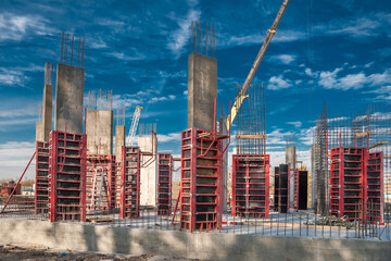 Column formwork and crane on house construction.