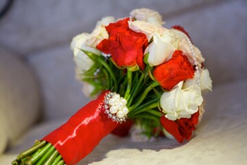 Bright wedding bouquet for the ceremony from fresh flowers