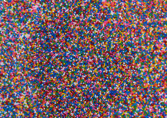  background of colorful sprinkles for sweets or beads or small balls. The concept of celebrating a birthday, party or other holidays. trendy, cute background