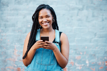 Happy black woman, portrait smile and phone in communication, texting and social media outdoors....